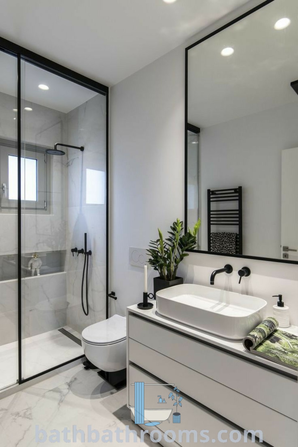 A modern small bathroom featuring a large mirror, sink, toilet, and shower stall, designed for maximum style and functionality. Discover inspiring small bathroom ideas and decor options at bathbathrooms.com.