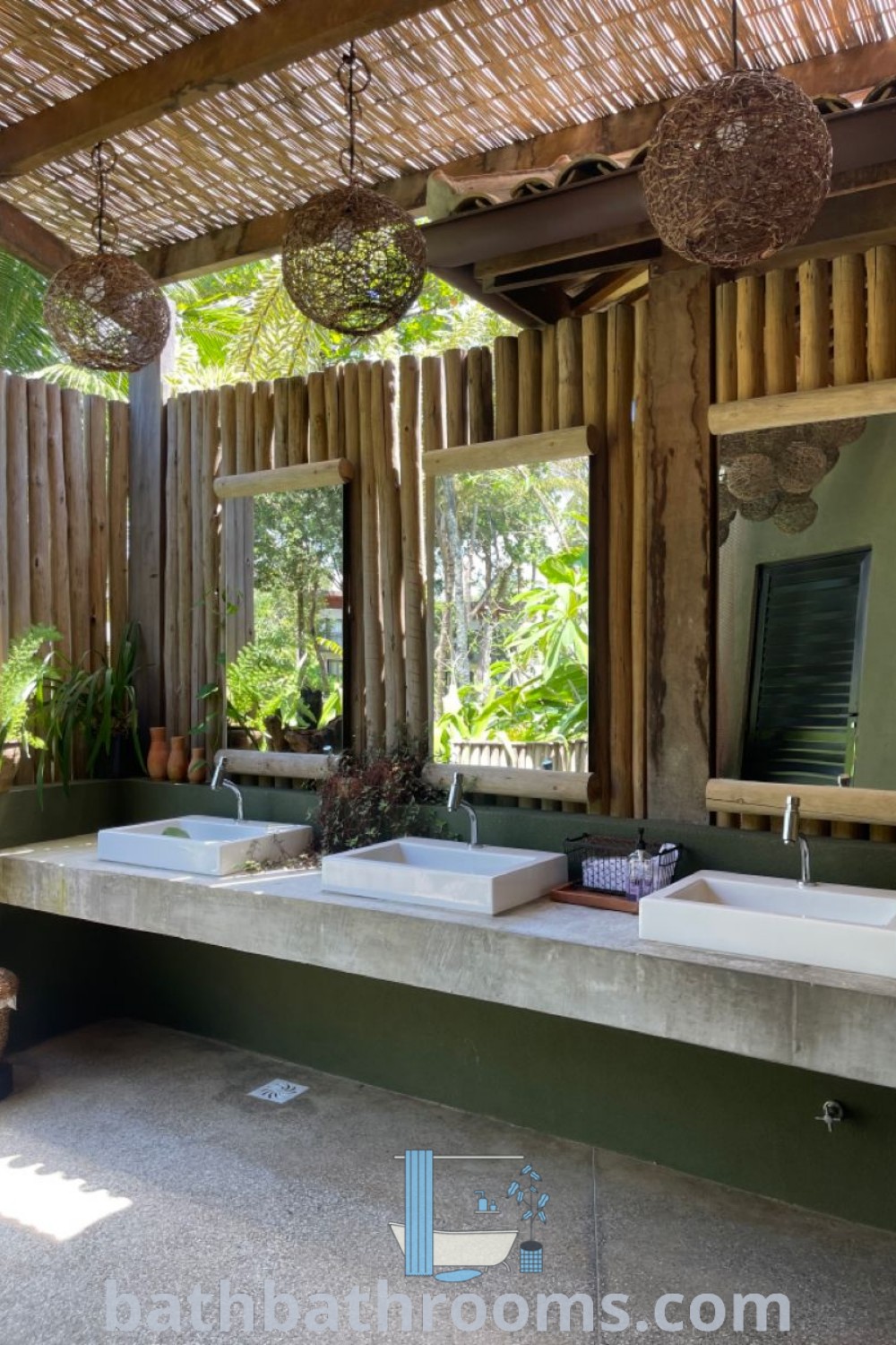 An outdoor bathroom showcasing white decor with green straw accents, embodying tropical shower ideas and restroom inspirations. This space promotes a cozy and inviting atmosphere, perfect for outdoor settings like Porto Beach or coconut farms. Discover additional ideas on bathbathrooms.com.