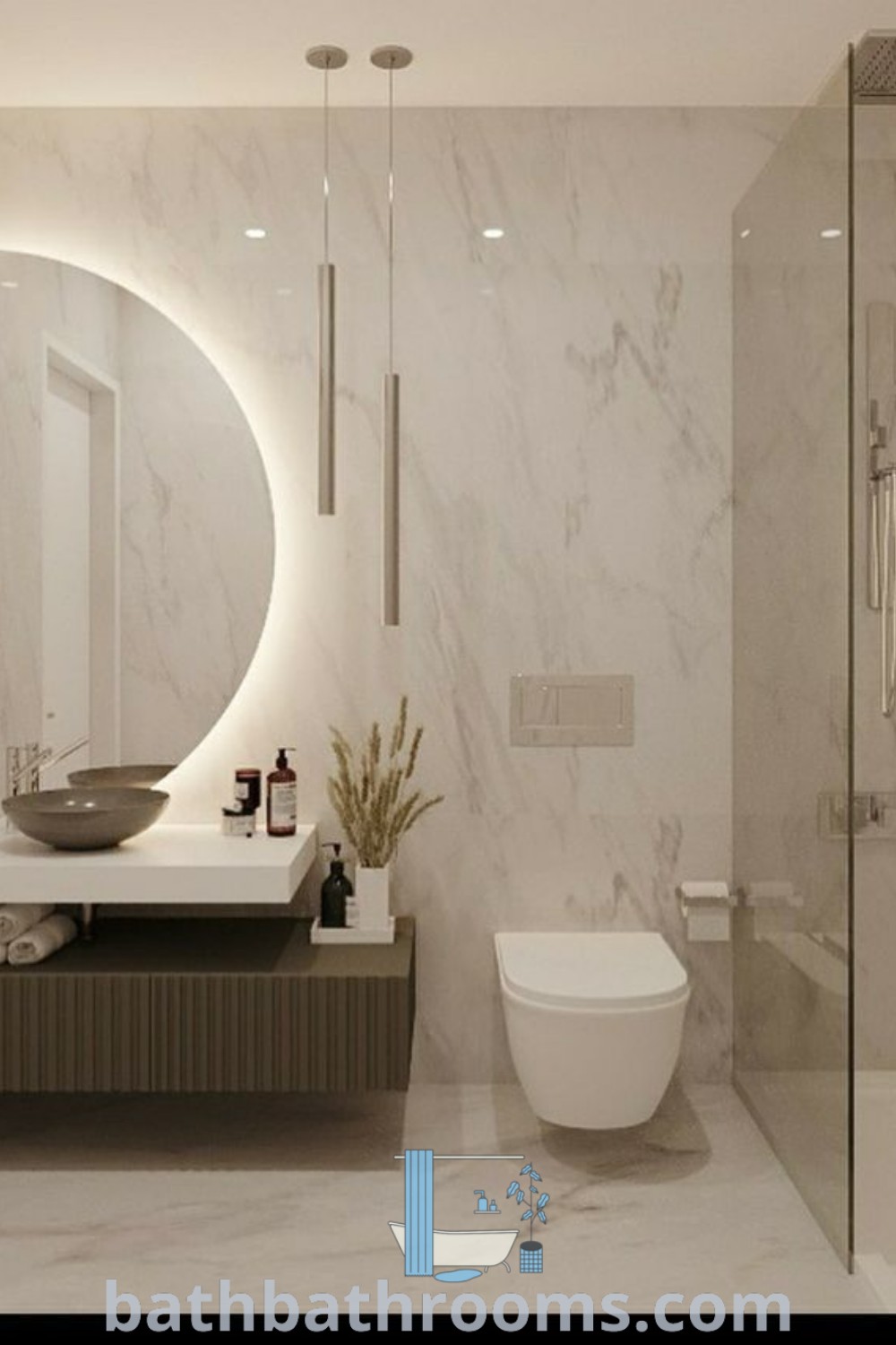 A modern bathroom with marble walls and flooring, featuring a round mirror above the sink, representing a luxurious and elegant design. Explore contemporary bathroom ideas and inspirations for small spaces at bathbathrooms.com.