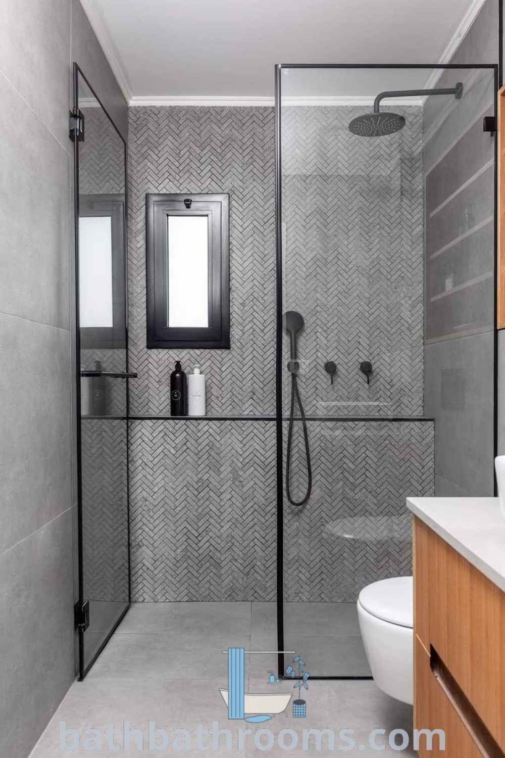 A modern bathroom featuring a walk-in shower, white toilet, and wooden cabinetry, showcasing stylish shower-only remodel ideas. This space epitomizes small bathroom shower ideas and functional designs, providing inspiring decor ideas for small spaces. Visit bathbathrooms.com for more unique inspirations.