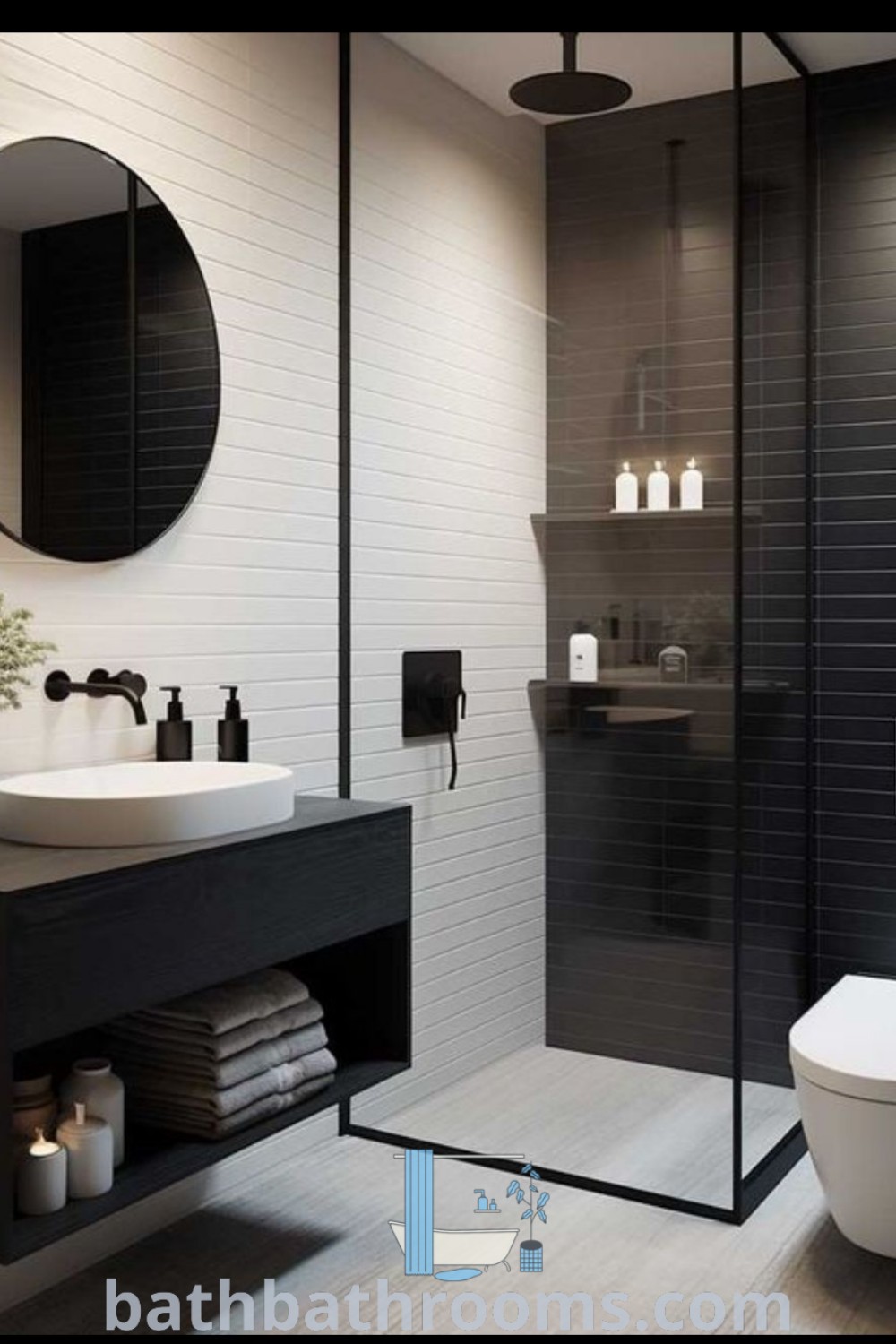 A compact black and white bathroom with a toilet, sink, mirror, and shower stall, showcasing stylish black tiles and decor ideas for small spaces. Explore inspiring design tips on bathbathrooms.com.