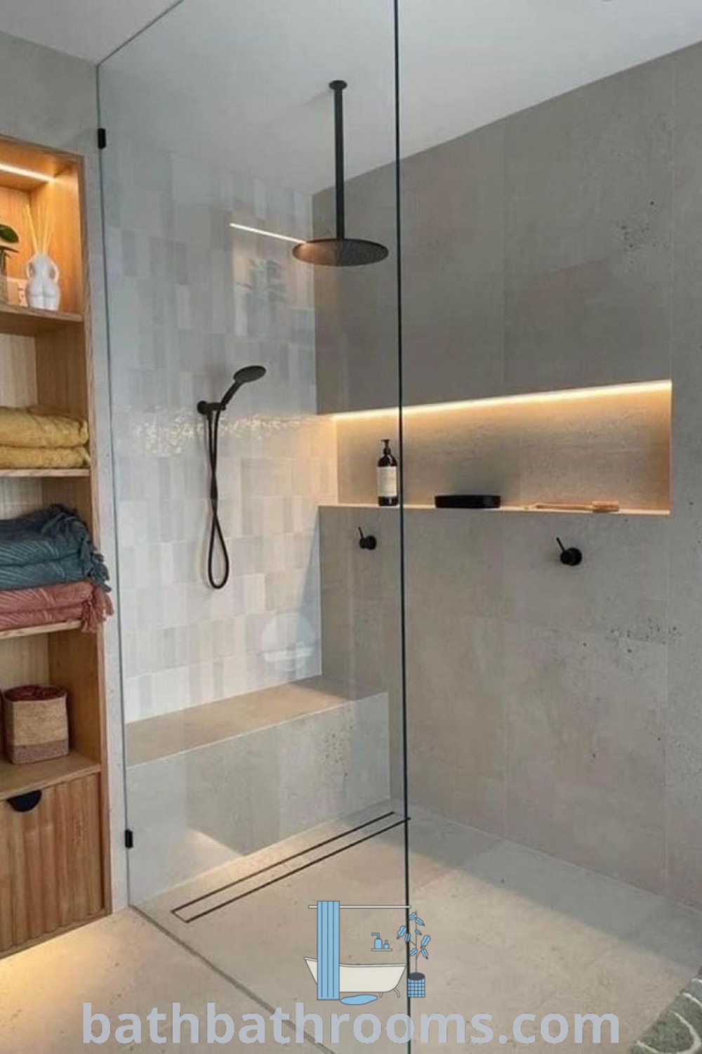 A stylish walk-in shower beside a wooden shelf, showcasing a modern bathroom redesign. This wet room combines functionality with beautiful decor ideas, perfect for inspiring your bathroom remodel journey at bathbathrooms.com.
