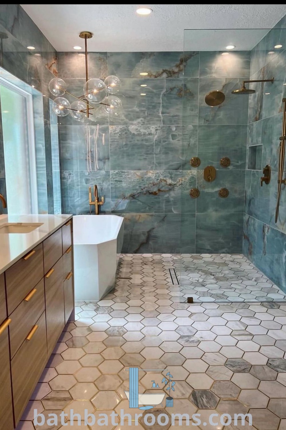 A luxurious large bathroom with blue marble and gold accents on the shower wall, tub, and sink, demonstrating modern bathroom decoration and timeless decor ideas. Explore inspiring bathroom design tips and makeover inspirations at bathbathrooms.com.