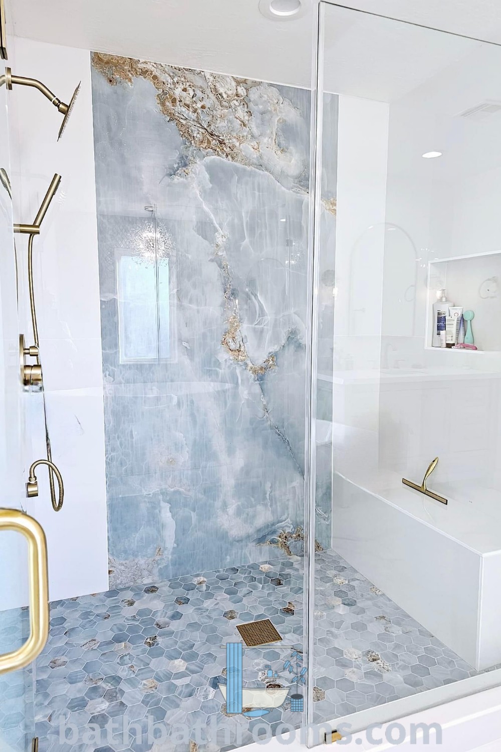 An elegant bathroom featuring a walk-in shower next to a bathtub, accented with small white tiles and gold fixtures. The design reflects unique tile shower ideas and master bath remodel trends, providing inspirations for creating cozy, functional spaces at bathbathrooms.com.