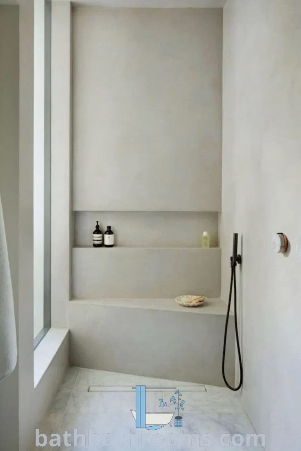 A minimalist concrete bathroom showcasing stylish decor and a clean aesthetic. This design embodies loft home inspirations and unique ideas for house additions, illustrating a perfect fusion of style and functionality. Discover more decor ideas at bathbathrooms.com.