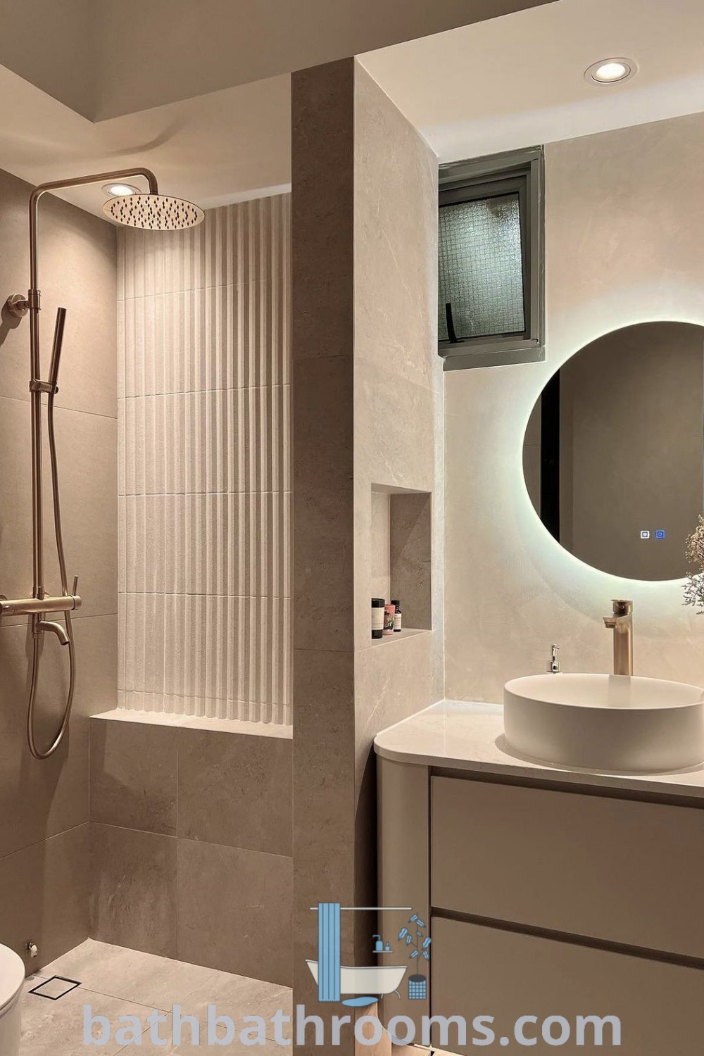 A stylish small ensuite bathroom featuring beige tones, a sleek shower divider, and a cozy seating area. The design incorporates inspiring ideas for a water closet and small bathroom decor, creating a clean and inviting space. Explore more unique ideas at bathbathrooms.com.
