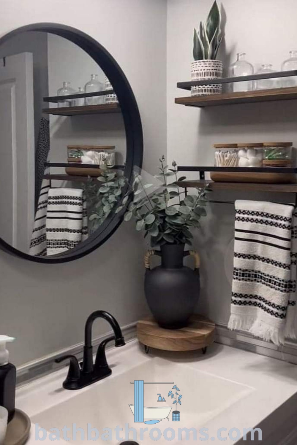 A stylish bathroom sink under a mirror next to a black and white potted plant, showcasing design ideas for apartment decor. This setup represents budget restroom decor and cozy aesthetic inspirations perfect for small spaces. Find more ideas at bathbathrooms.com.