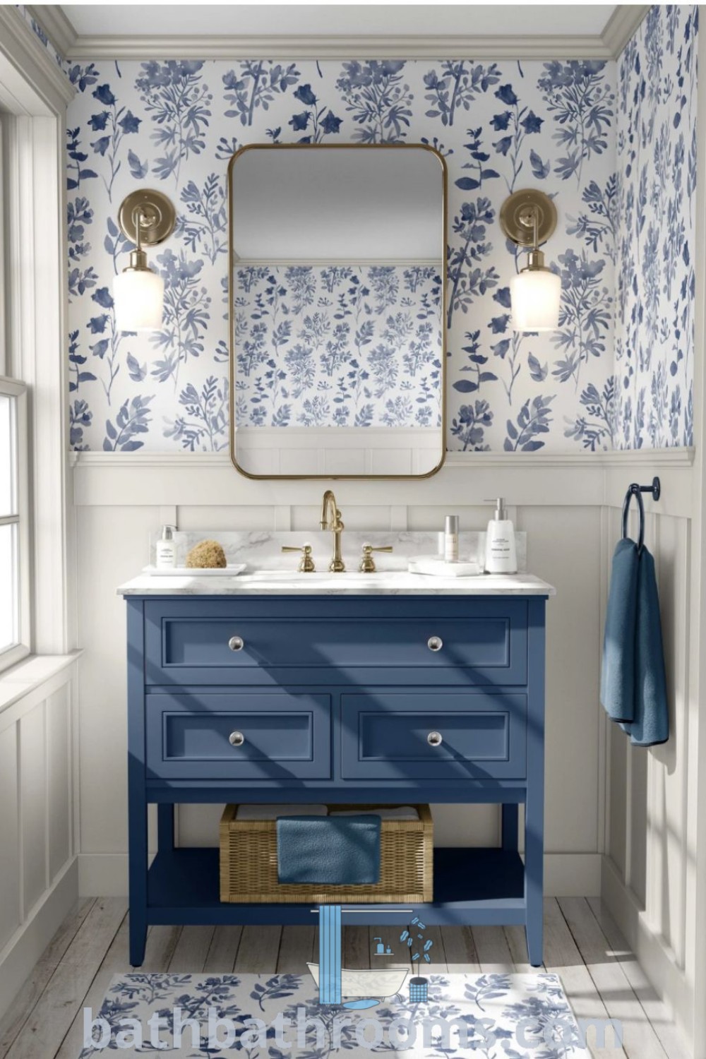A beautiful blue and white bathroom with floral wallpaper, two sinks, and a mirror, reflecting blue Mediterranean and French country bathroom design trends. This cozy decor inspires ideas for maximizing style and space. Explore more designs and decor ideas at bathbathrooms.com.