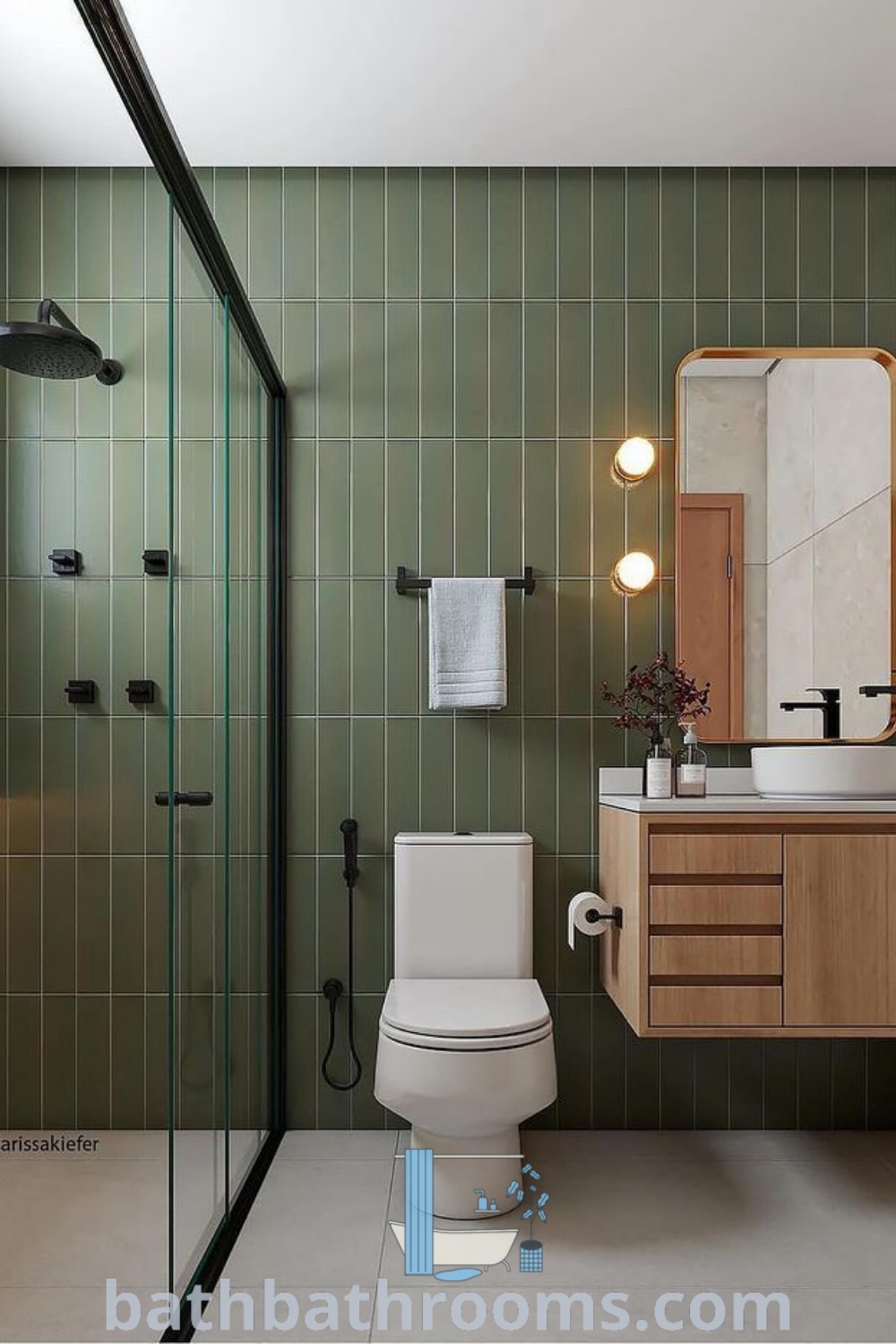 A modern bathroom featuring a toilet, sink, and shower in its stall area alongside a walk-in shower, showcasing inspiring design ideas and decor inspirations for small spaces. Discover more beautiful bathroom renovations at bathbathrooms.com.
