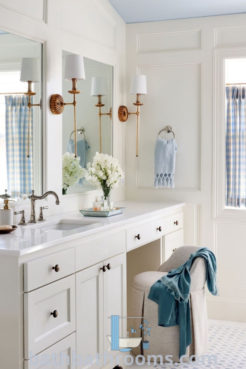 An elegant French bathroom featuring two sinks, blue curtains on the windowsill, and sophisticated decor ideas for southern interiors. This luxurious space combines functionality with style, perfect for master additions and unique design inspirations. Discover more at bathbathrooms.com.