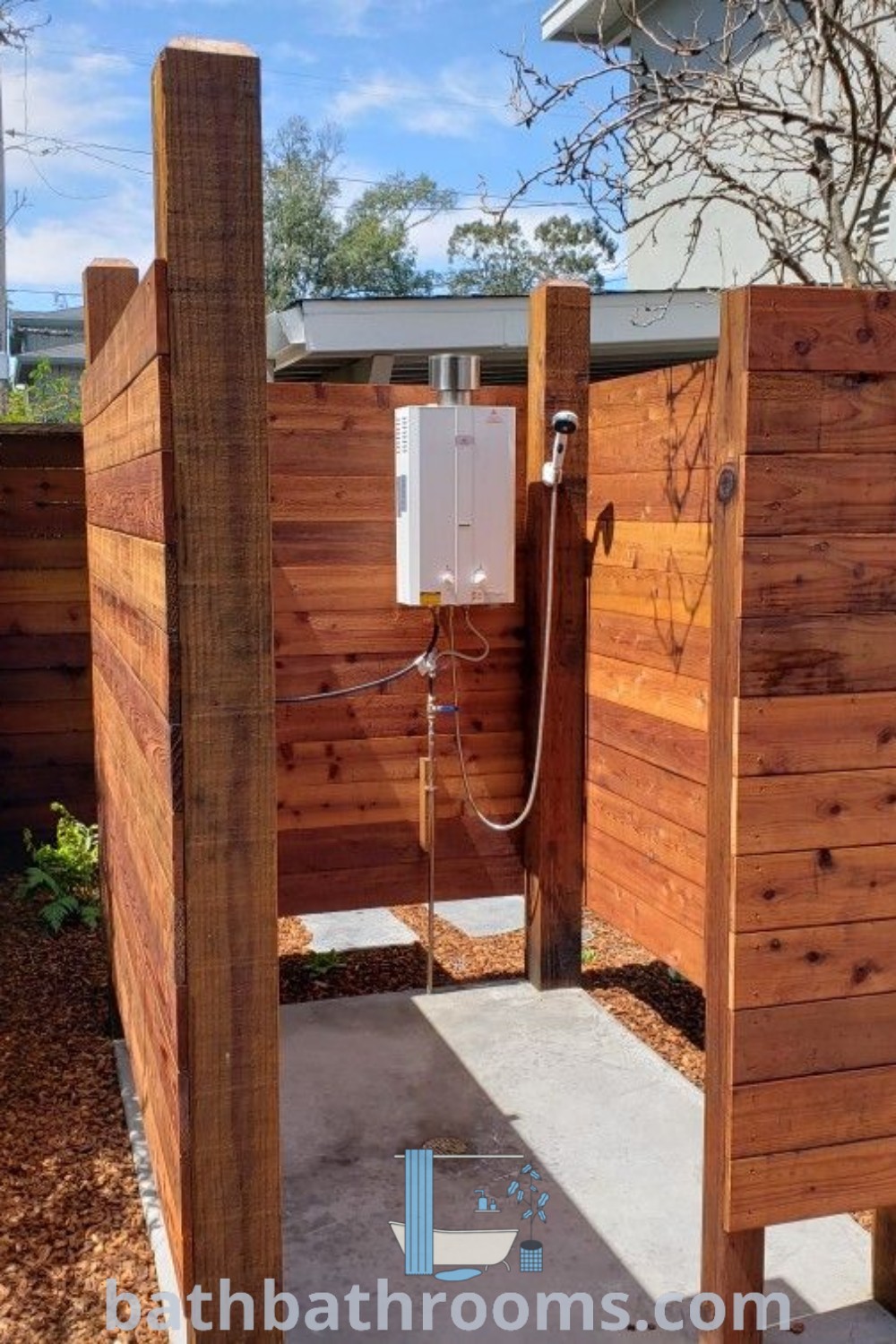 A cozy outdoor phone booth made of wooden planks in front of a house surrounded by trees and shrubbery, showcasing unique design ideas for a garden space. Perfect for outdoor shower ideas and sauna inspirations, discover more decor ideas at bathbathrooms.com.
