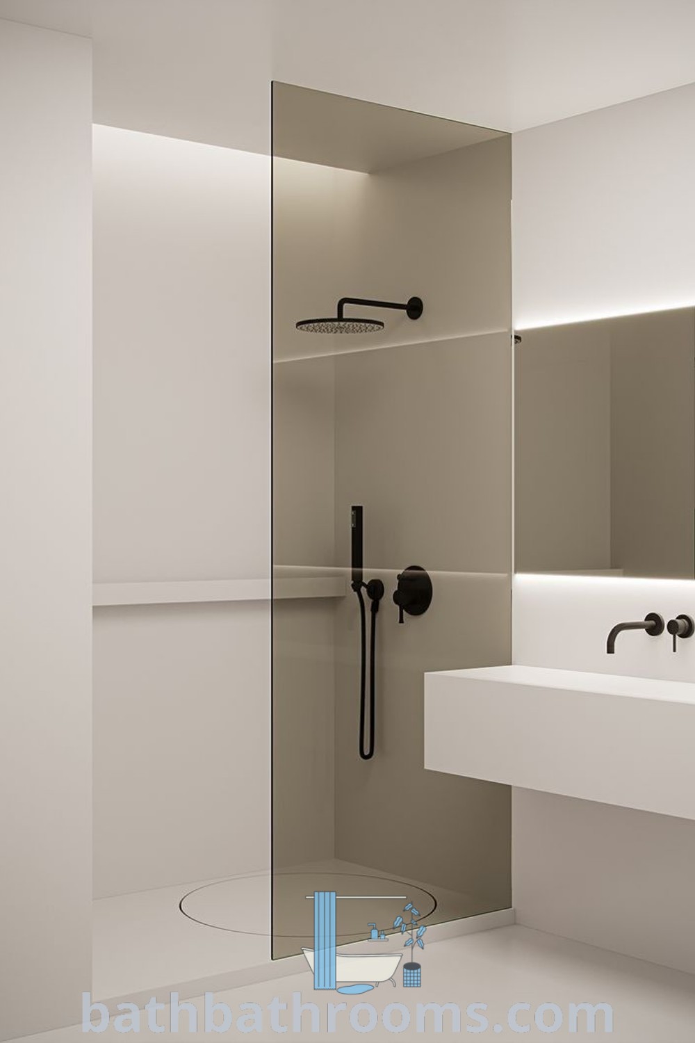 A modern bathroom featuring a sink, mirror, and shower head in the corner, showcasing contemporary vanity bathroom organization. The design includes stylish minimalistic toilets and decor ideas for cozy spaces. Explore more bathroom inspirations at bathbathrooms.com.