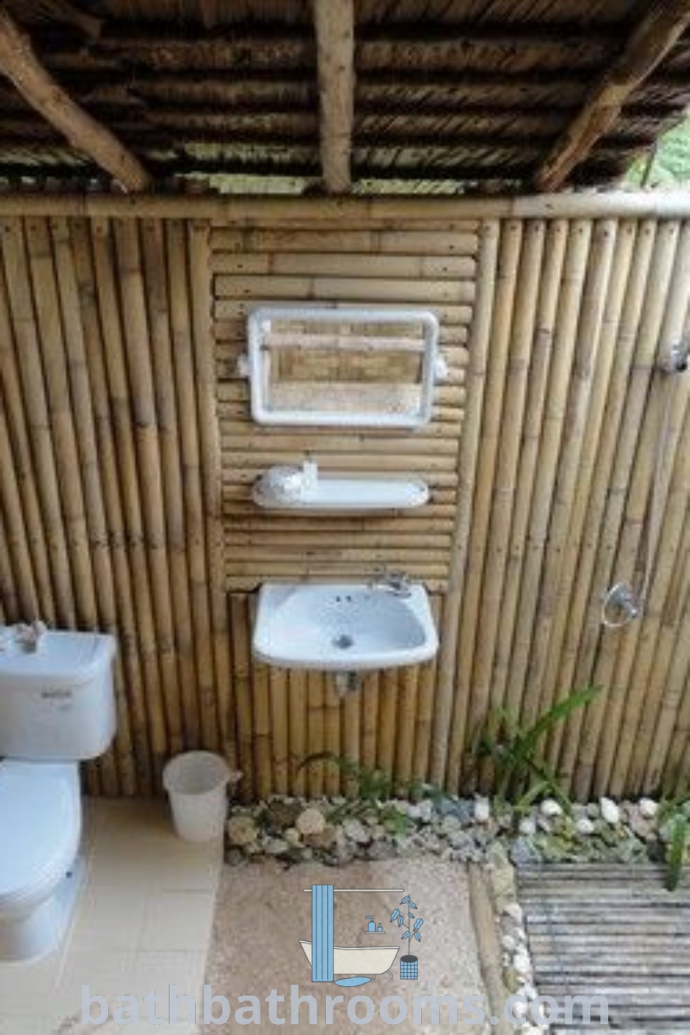 An outdoor bathroom with bamboo walls and flooring that showcases stylish outdoor bathroom design ideas. This inviting space invites relaxation and is perfect for transforming garden patios and pool areas. Discover more decor inspirations at bathbathrooms.com.