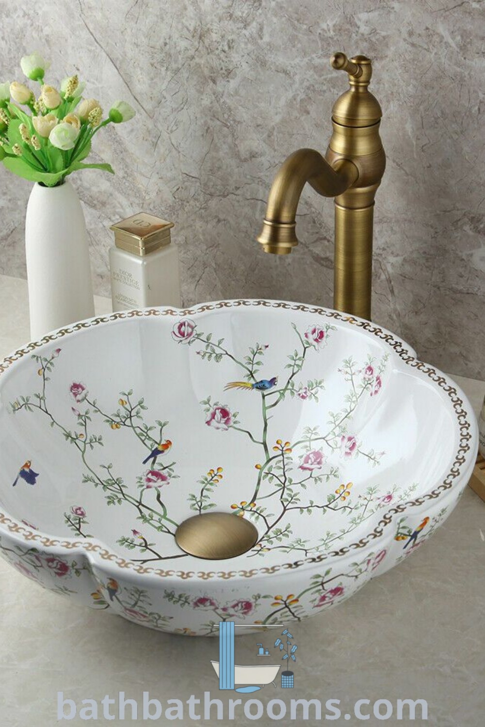 A cozy bathroom sink featuring colorful flowers and a stylish faucet in the corner, creating a warm and inviting atmosphere. Discover more unique decor ideas and inspirations for your home at bathbathrooms.com.