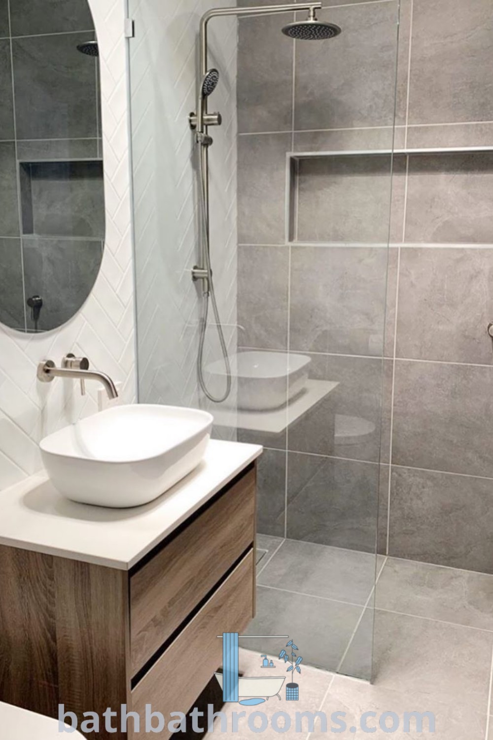 A stylish off white bathroom featuring a white sink under a mirror, next to a walk-in shower and toilet, showcasing cozy decor ideas and design trends for small en-suites. Discover more inspirations for your home at bathbathrooms.com.