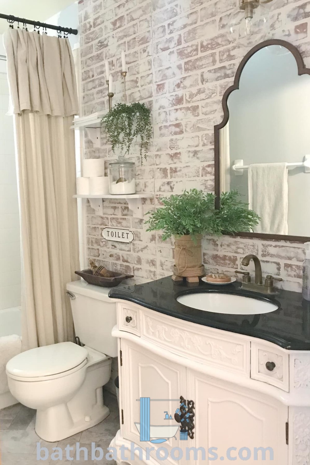 A cozy bathroom with a brick wall, white fixtures, a black countertop sink, and modern accents. This design exemplifies unique ideas for bathroom redecoration, blending farmhouse style with modern elements. Discover more decor inspirations at bathbathrooms.com.