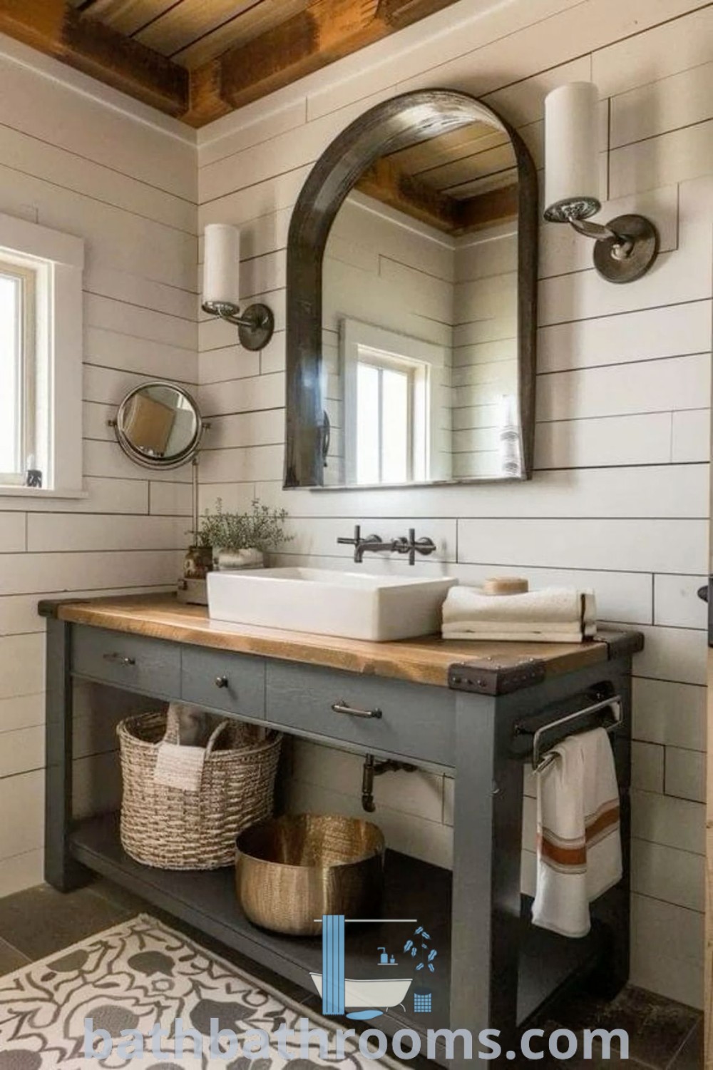 A cozy cottage style bathroom with a sink, mirror, and rug, featuring farmhouse bathroom countertops and rustic decor elements. This inspiring design encapsulates cozy aesthetics, perfect for elevating any bathroom space. Discover more ideas for your home at bathbathrooms.com.