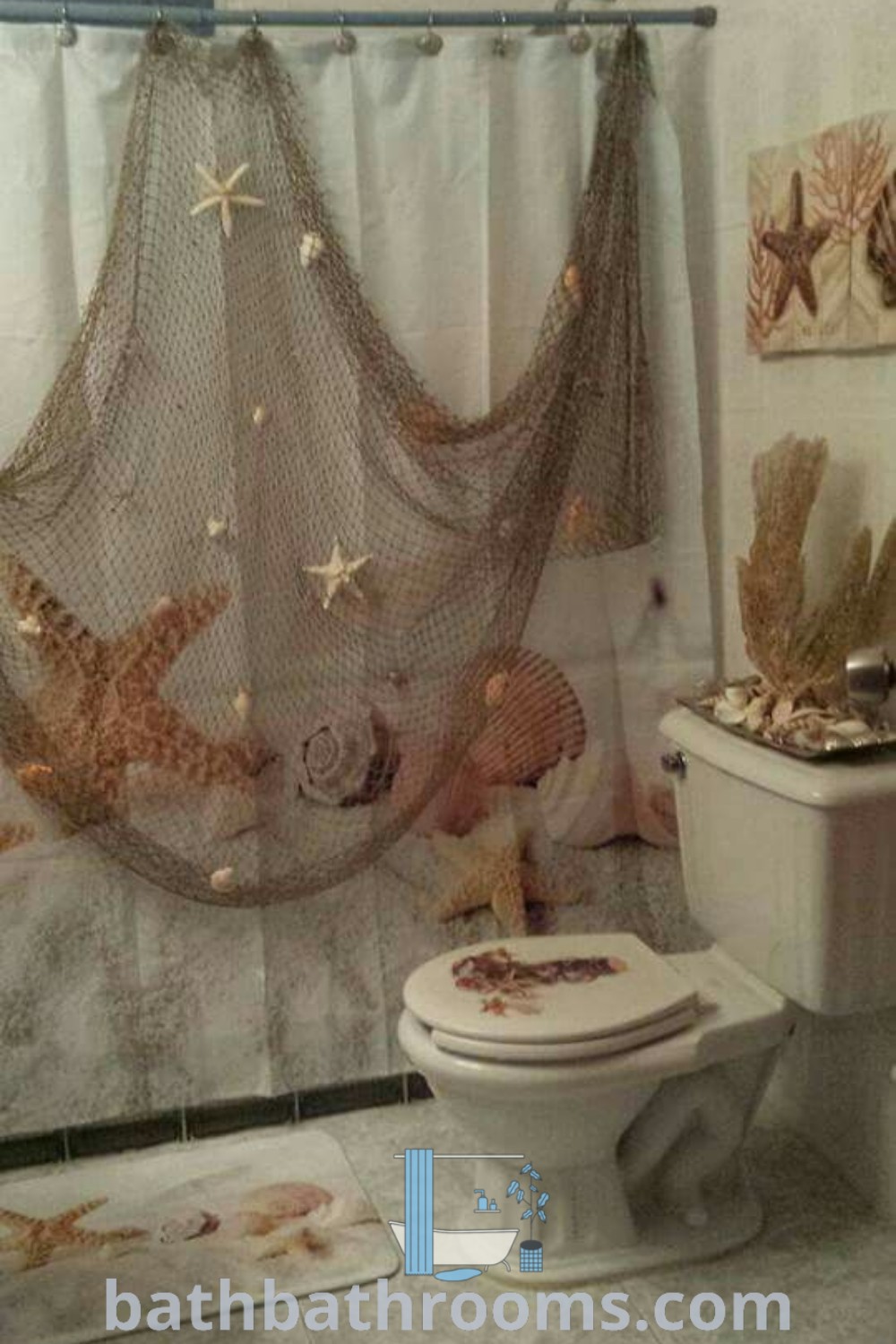 A beach-inspired bathroom featuring a shower curtain, toilet, and starfish decorations on the wall. This modern mermaid-themed bathroom showcases cozy decor ideas that bring ocean charm to your home. Explore more unique ideas at bathbathrooms.com.