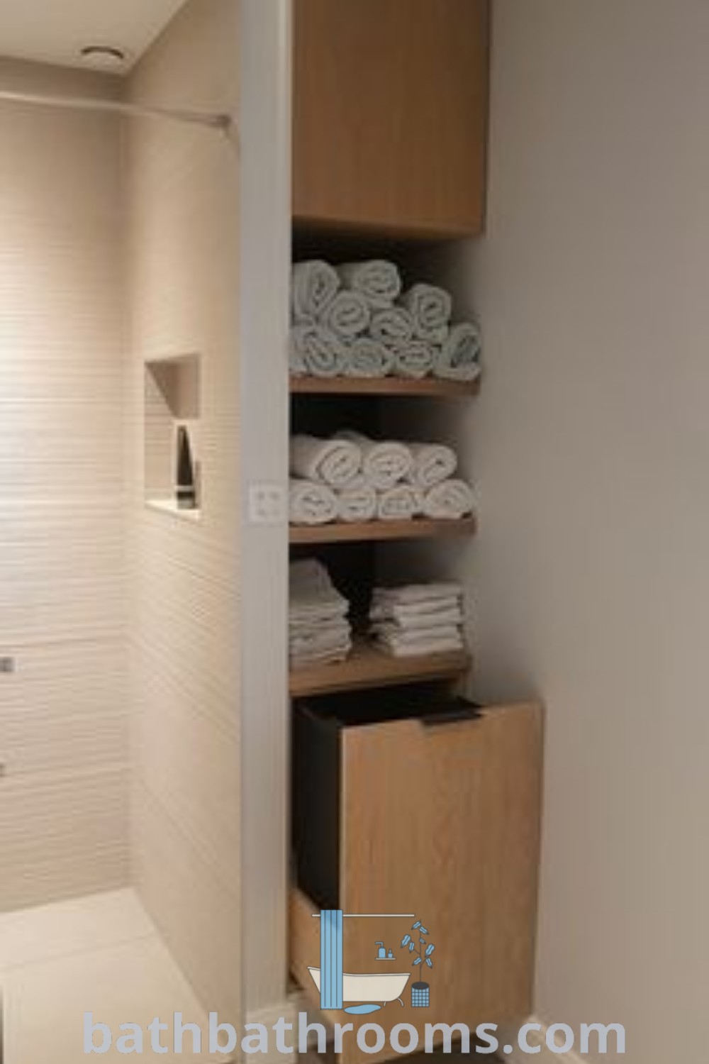 A clean and organized bathroom designed for towel storage, featuring stunning farmhouse decor that blends functionality with style. This inspiring space highlights unique ideas for maximizing storage while creating a cozy and inviting atmosphere. Explore design inspirations at bathbathrooms.com.