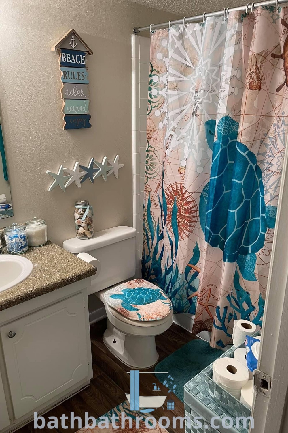 A cozy safari-themed bathroom featuring a toilet, sink, and a unique shower curtain, showcasing inspiring blue bathroom ideas and thoughtful decor inspirations. Perfect for maximizing style and space in guest bathrooms. Discover more design tips at bathbathrooms.com.