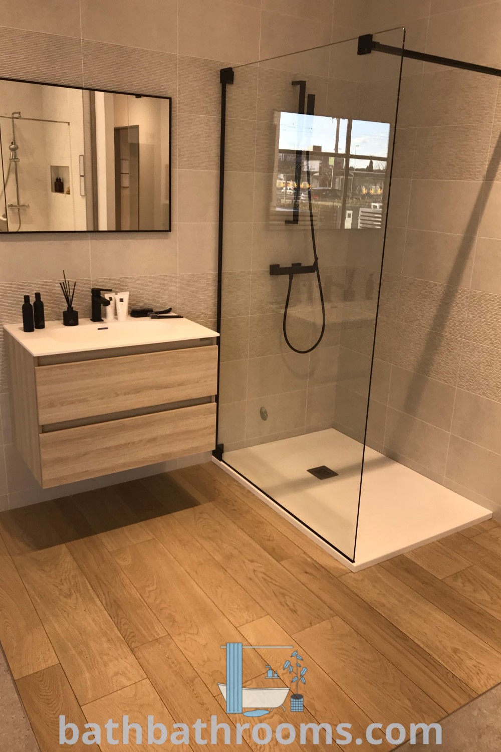 A modern luxury bathroom with a central sink, mirror, and shower design, showcasing cozy aesthetics and functional decor ideas. Explore more inspirations at bathbathrooms.com.