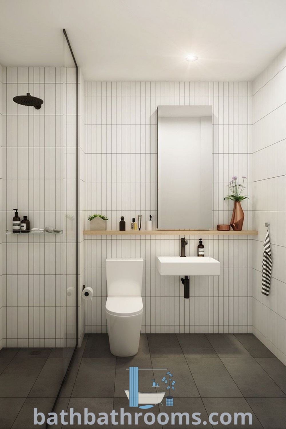 A white bathroom with tiled walls and floor showcasing a Muji style, featuring a corner wash basin, wainscoting shelf, and subway tile backsplash. This cozy design offers inspiring bathroom ideas for small spaces and modern bathrooms at bathbathrooms.com.