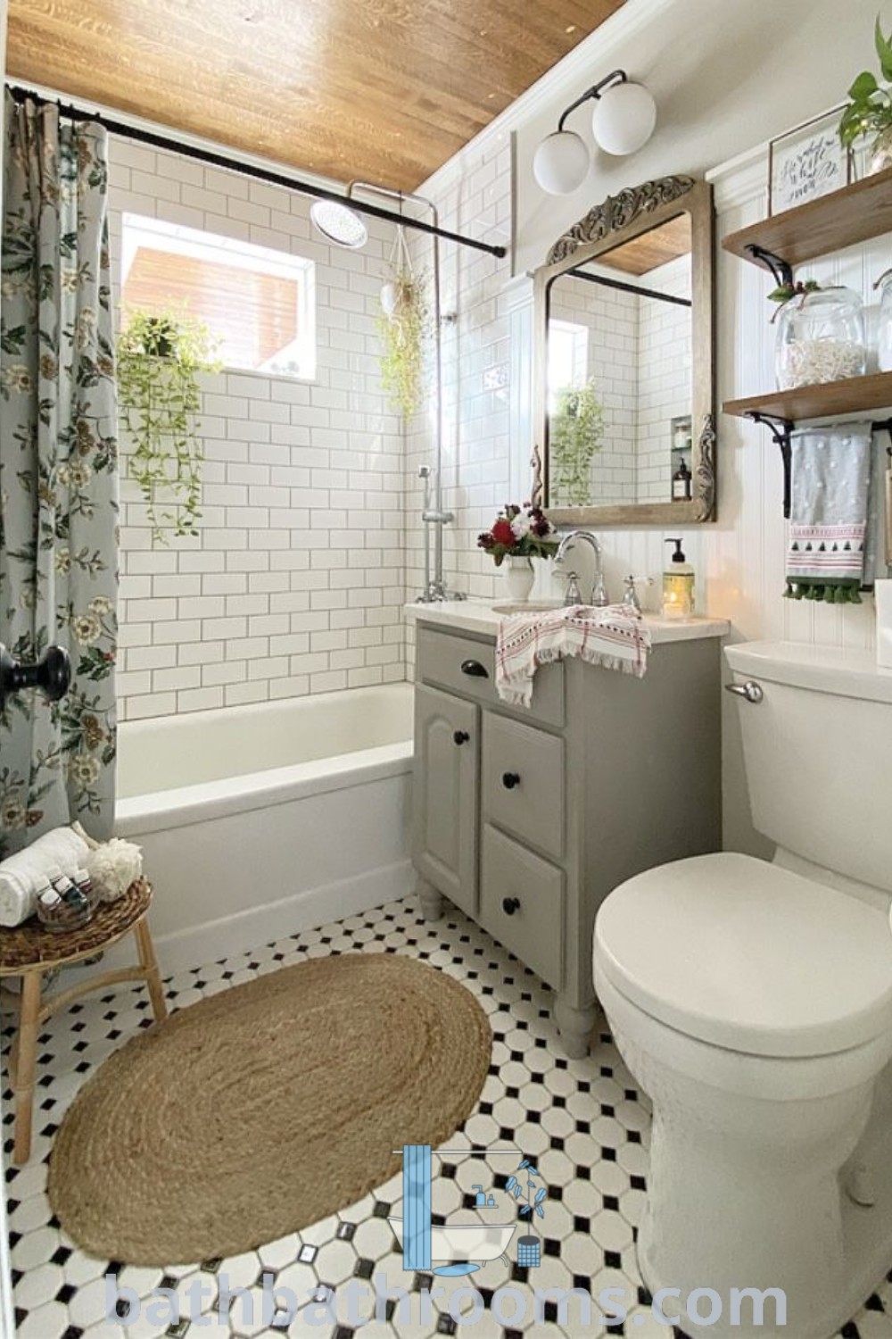 A cozy cottage bathroom featuring a white toilet and bath tub under a wooden ceiling, showcasing romantic small bathroom ideas and cottagecore aesthetic. This space provides unique decor inspirations for a perfect style fusion, ideal for small spaces. Explore more at bathbathrooms.com.