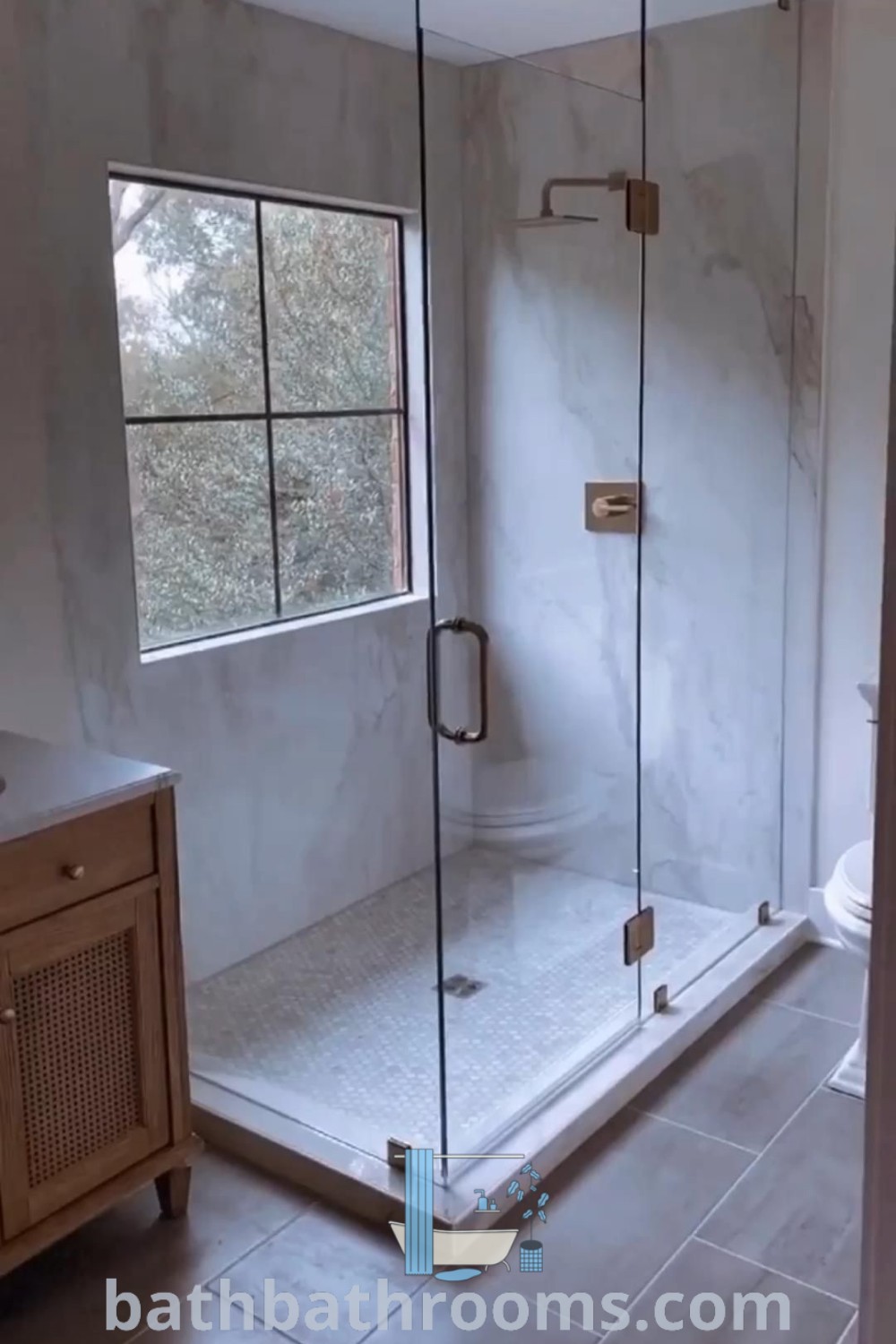An elegant walk-in shower with a window and sliding glass door, showcasing inspiring design ideas for small spaces. This perfect blend of aesthetics and functionality encourages cozy home inspirations. Explore more design trends at bathbathrooms.com.