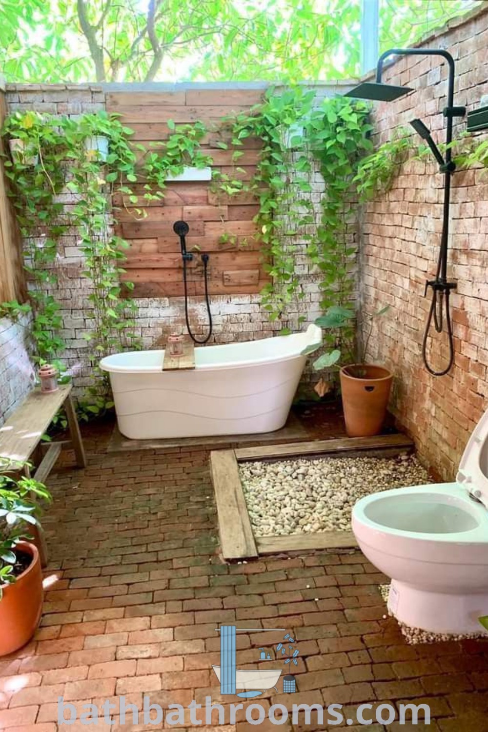 An outdoor bathroom with brick walls and flooring, featuring a bathtub in the center that embodies Village Bathroom Ideas and Outside Bathroom Ideas. The design offers perfect harmony with nature and functional style. Discover more outdoor inspirations at bathbathrooms.com.