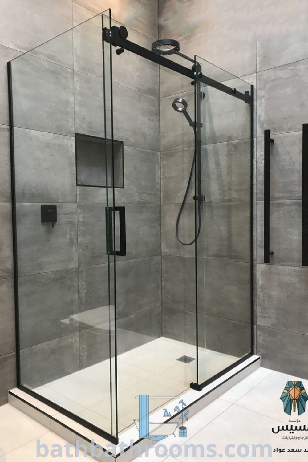 A modern minimalist bathroom showcasing a walk-in shower next to a toilet, featuring frameless sliding glass doors. This design maximizes style and space, perfect for cozy aesthetics. Explore more decor ideas for your bathroom at bathbathrooms.com.