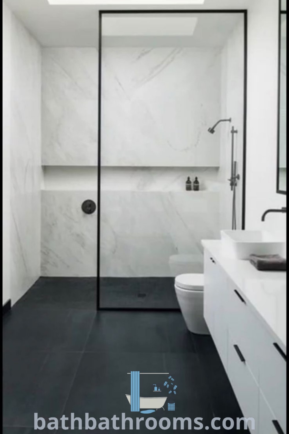 A modern small bathroom design showcasing white shower walls, black tile flooring, and an open skylight above the toilet, featuring inspiring decor ideas for a cozy aesthetic. Discover more design inspirations at bathbathrooms.com.