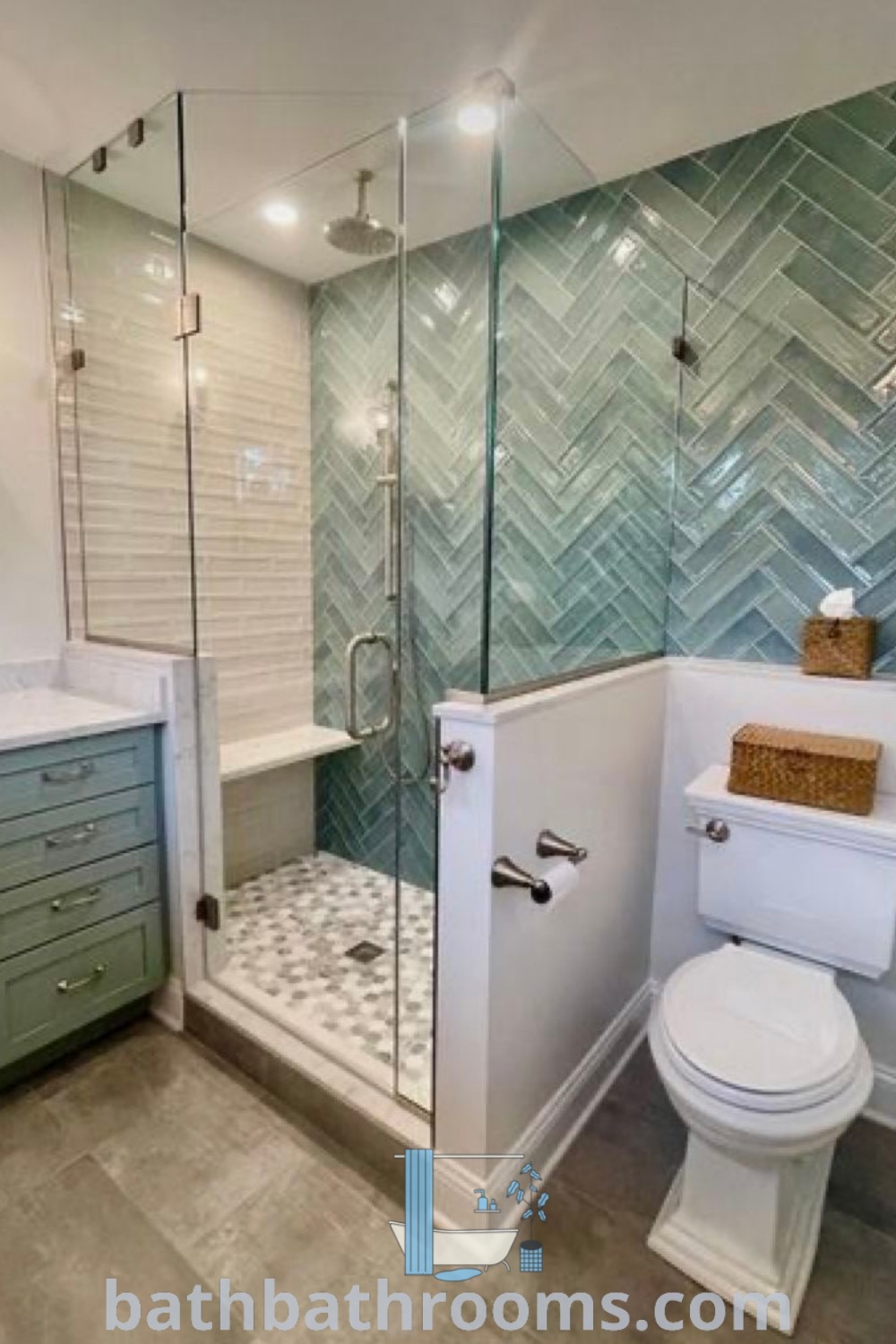 A modern coastal bathroom showcasing a white toilet, walk-in shower, and stylish sink next to glass tiled showers, ideal for those seeking coastal bathroom ideas. Explore unique design inspirations at bathbathrooms.com.